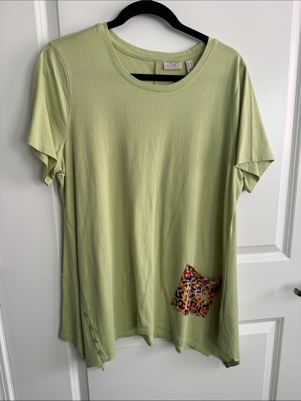 LOGO by Lori Goldstein light lime green top with shark bite hemline.